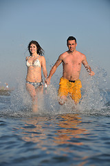 Image showing happy young couple have fun on beach