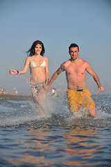 Image showing happy young couple have fun on beach