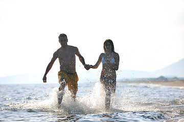 Image showing happy young couple have fun on beach