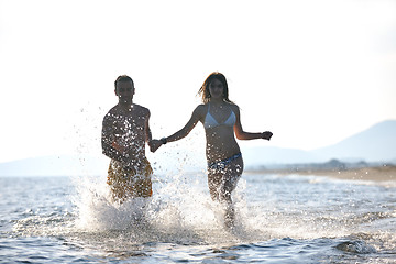 Image showing happy young couple have fun on beach