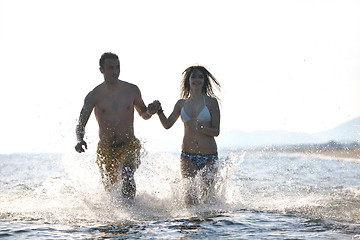 Image showing happy young couple have fun on beach