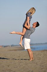 Image showing happy young couple have fun on beach