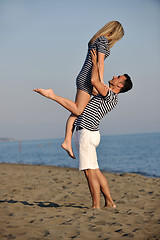 Image showing happy young couple have fun on beach