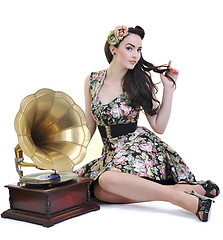 Image showing pretty girl listening music on old gramophone