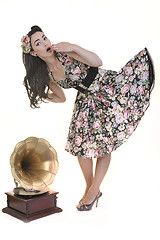 Image showing pretty girl listening music on old gramophone