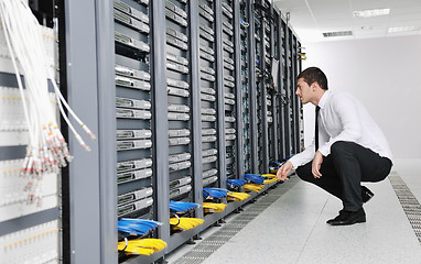 Image showing young it engeneer in datacenter server room