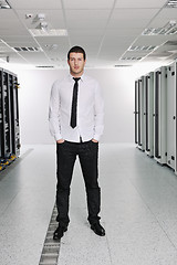 Image showing young it engeneer in datacenter server room