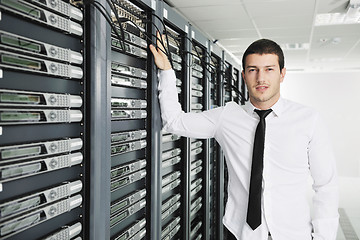 Image showing young it engeneer in datacenter server room