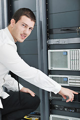 Image showing young it engeneer in datacenter server room