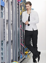 Image showing young it engeneer in datacenter server room