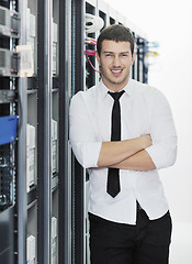 Image showing young it engeneer in datacenter server room