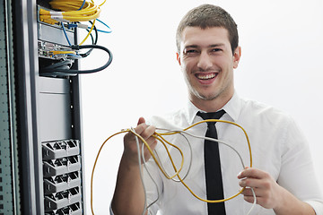 Image showing young it engeneer in datacenter server room