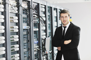 Image showing young it engeneer in datacenter server room