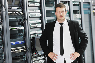 Image showing young it engeneer in datacenter server room