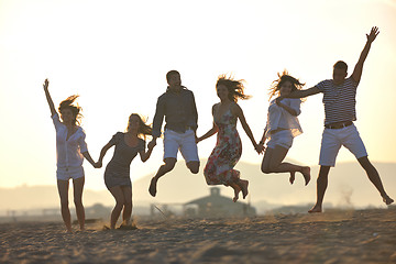 Image showing Group of happy young people in have fun at beach