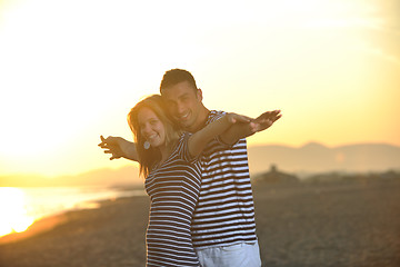 Image showing happy young couple have fun on beach