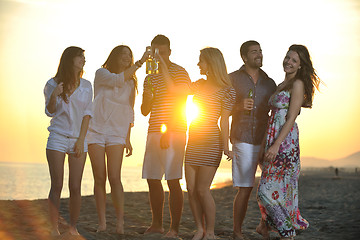 Image showing Group of young people enjoy summer  party at the beach