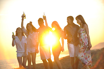 Image showing Group of young people enjoy summer  party at the beach