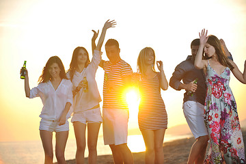 Image showing Group of young people enjoy summer  party at the beach