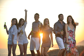 Image showing Group of young people enjoy summer  party at the beach