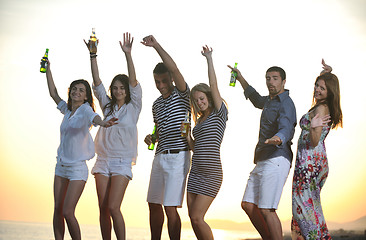 Image showing Group of young people enjoy summer  party at the beach