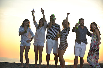 Image showing Group of young people enjoy summer  party at the beach