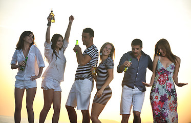 Image showing Group of young people enjoy summer  party at the beach