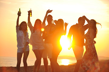 Image showing Group of young people enjoy summer  party at the beach