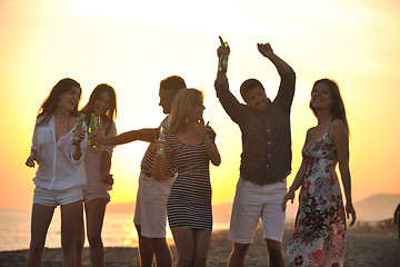 Image showing Group of young people enjoy summer  party at the beach