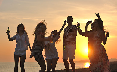 Image showing Group of young people enjoy summer  party at the beach