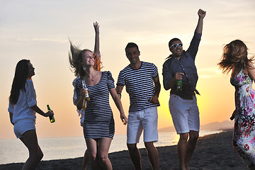 Image showing Group of young people enjoy summer  party at the beach