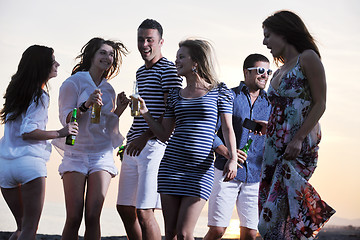 Image showing Group of young people enjoy summer  party at the beach