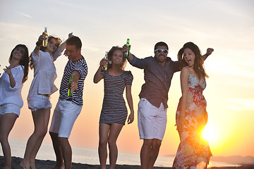 Image showing Group of young people enjoy summer  party at the beach