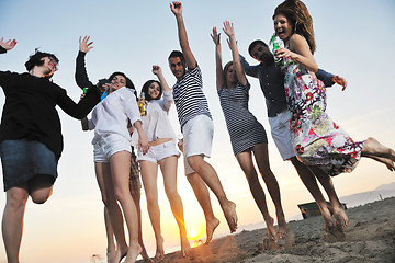 Image showing Group of young people enjoy summer  party at the beach