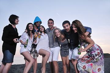 Image showing Group of young people enjoy summer  party at the beach