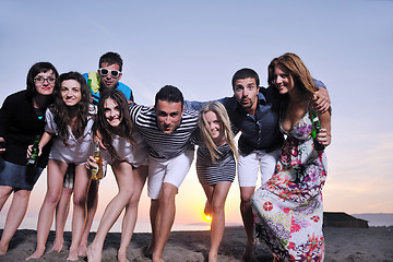 Image showing Group of young people enjoy summer  party at the beach