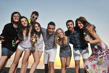 Image showing Group of young people enjoy summer  party at the beach