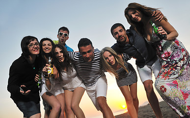 Image showing Group of young people enjoy summer  party at the beach