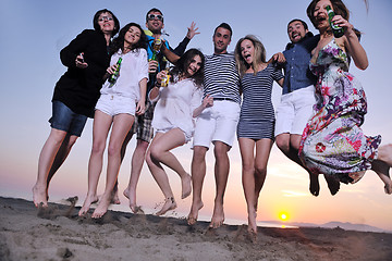 Image showing Group of young people enjoy summer  party at the beach