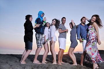 Image showing Group of young people enjoy summer  party at the beach