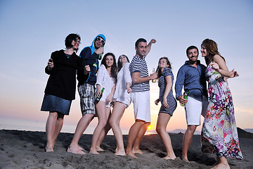 Image showing Group of young people enjoy summer  party at the beach