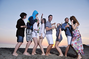 Image showing Group of young people enjoy summer  party at the beach