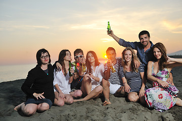 Image showing Group of young people enjoy summer  party at the beach