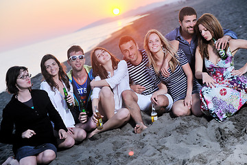 Image showing Group of young people enjoy summer  party at the beach