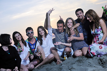 Image showing Group of young people enjoy summer  party at the beach