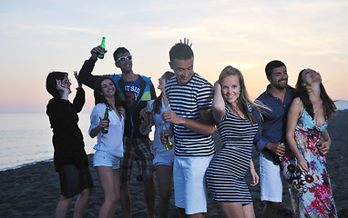 Image showing Group of young people enjoy summer  party at the beach