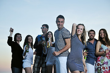 Image showing Group of young people enjoy summer  party at the beach