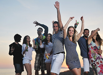 Image showing Group of young people enjoy summer  party at the beach