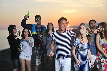 Image showing Group of young people enjoy summer  party at the beach