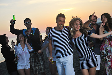 Image showing Group of young people enjoy summer  party at the beach